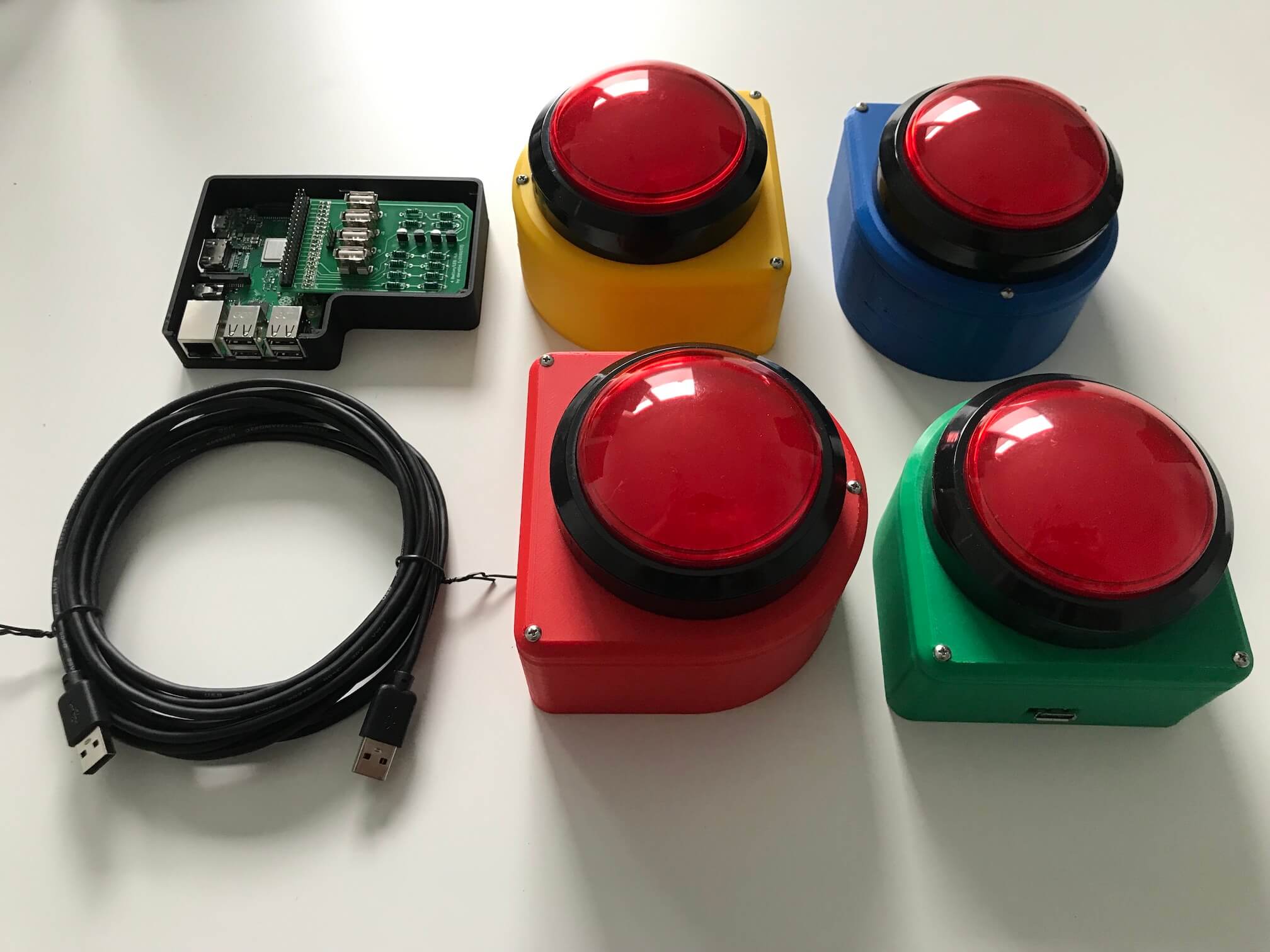 things with buzzers: The final result - four game show buzzers, a raspberry pi, and a custom printed circuit board.